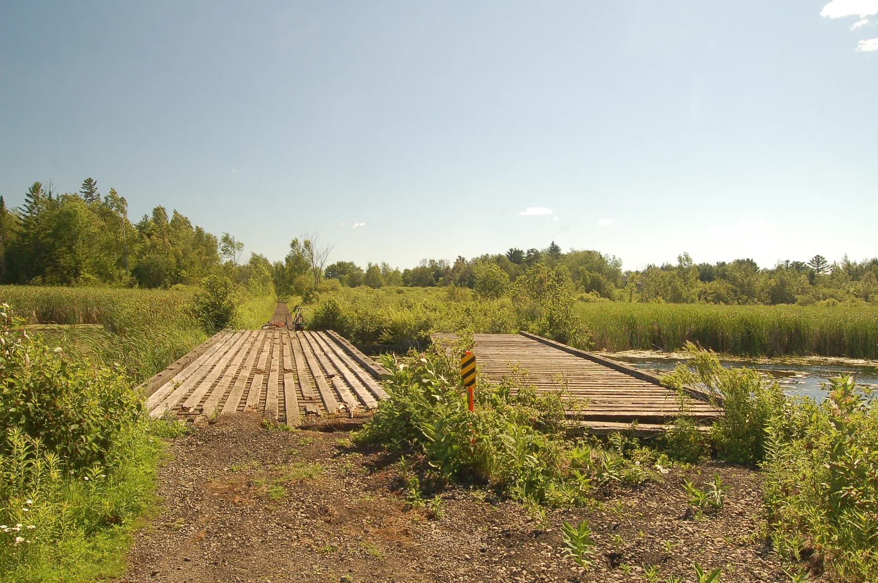 A wooden trail bridge at Blackwater Junction beside wetlands, photographed in 2010.
