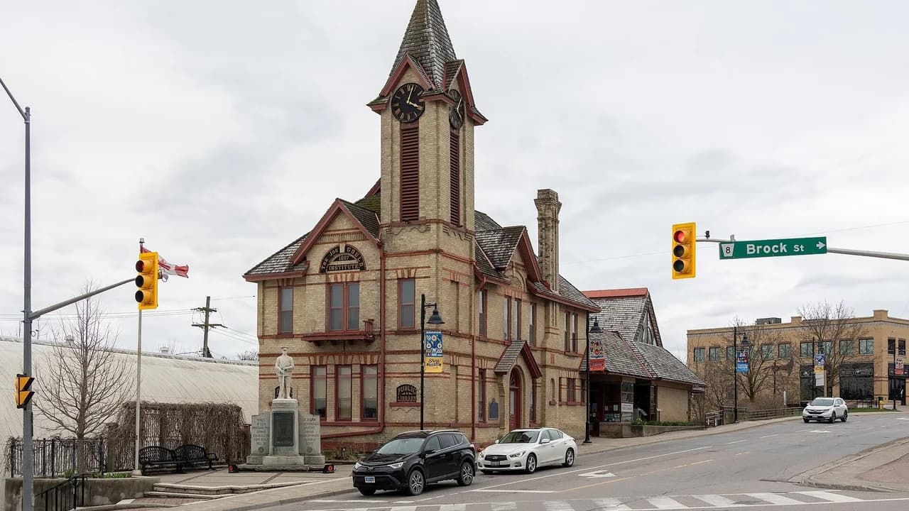 The Uxbridge Public Library, a historic brick building with a clock tower at Brock Street; no people visible.